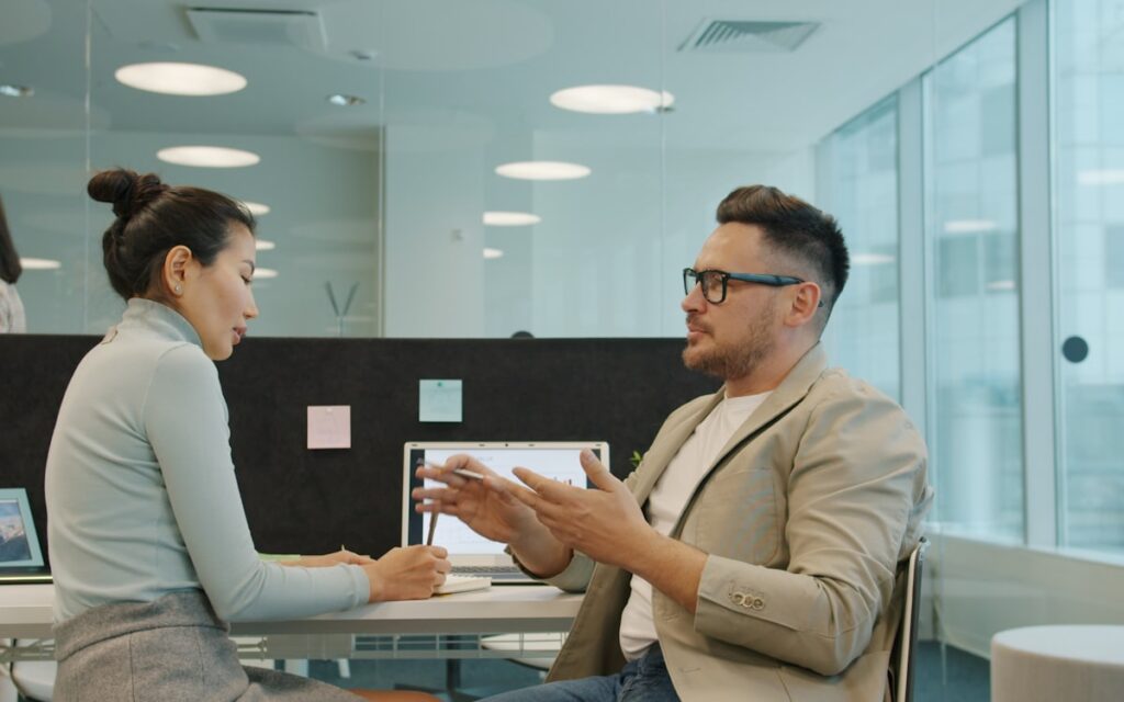 Manager Feedback Conversation Employee Office Desk